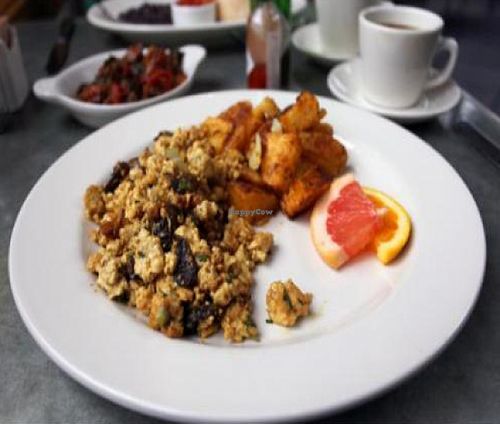 vegan summer mushroom scramble: scrambled tofu with spring onions, grilled cremini mushrooms, fresh tarragon and chives. at Cafe Flora in Seattle
