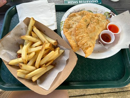 Two veggie empanadas with a side of fries at El Yunique Rainforest Cafe in Rio Grande