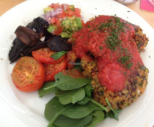 vegan breakfast with quinoa frittata, roast tomato, fresh Guacamole, spinach and mushrooms with a tomato relish! at Raw Energy in Coolum Beach