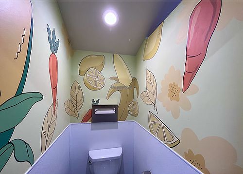 Yellow-orange toilet at Vegas Vegan Eatery in Las Vegas