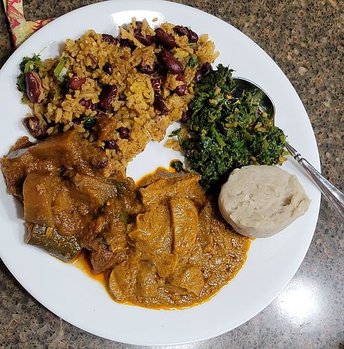 Rice & beans, 3 greens, oyster mushroom peanut butter stew, & zucchini & eggplant stew. at Motherland Kitchen in Frederick