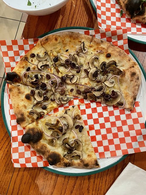 Build your own vegan pizza EVOO, shrooms, olives, red onion and garlic!   at Pisano's Woodfired Pizza in Bend