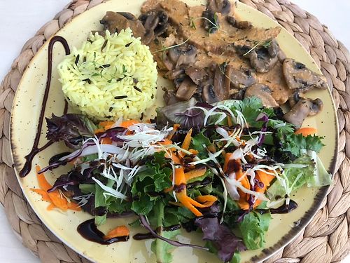 Seitan with mushrooms sauce, zafron rice and salad  at Cantina V in Santarem