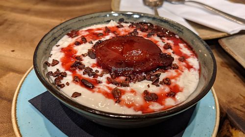 Coconut rice pudding with stewed plums at The Quarterhouse in Lancaster