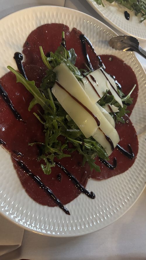 Carpaccio di bresaola con rucola e parmigiano  at Funghi E Tartufo in Melbourne