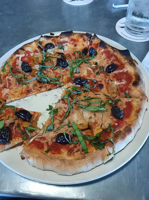 Vegan cheese. Calamata olives. Sundried tomatoes. Basil. at Flyover Brewing Company in Scottsbluff