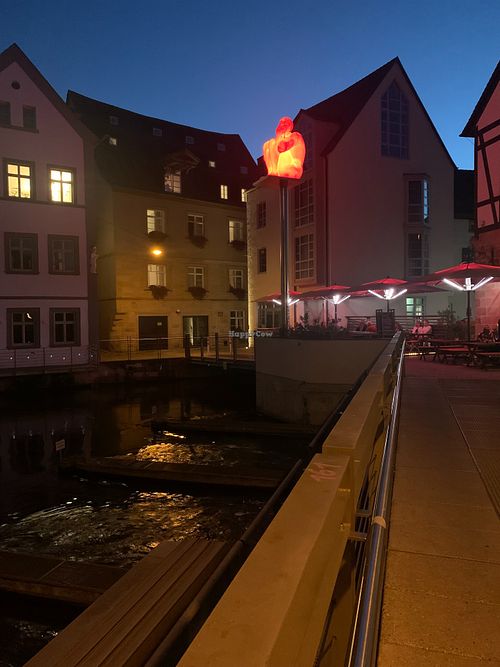 View of Eckerts Wirtshaus from a short distance away. Diners could sit outside over the water. at Eckerts Wirtshaus in Bamberg