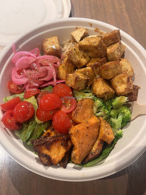 Made my own bowl - chose brown rice, lettuce, tofu, sweet potato, pickled red onion, broccoli, cherry tomatoes, and the thai vinaigrette sauce. $17.50 total  at Greenstreat in Brisbane