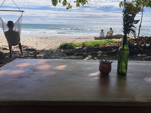 Ocean view seating at Rocamar Beach in Santa Teresa