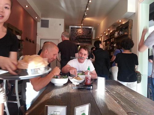 inside, communal table at Chau Veggie Express in Vancouver