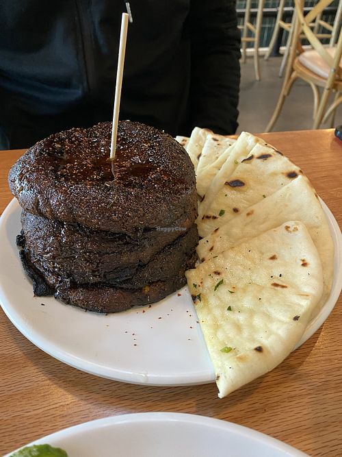 Mushroom Shawarma Feast For Two includes marinated and grilled shawarma tower (portobello mushrooms), Greek rice, salad, steamed veggies, tzatziki, hummus, pita  at Graze Kitchen  in Las Vegas