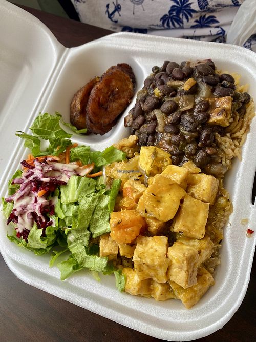 Large plate with salad, plaintains, quinoa, curry tofu, black bean stew  at Eden's Vegan Eatery in St Croix