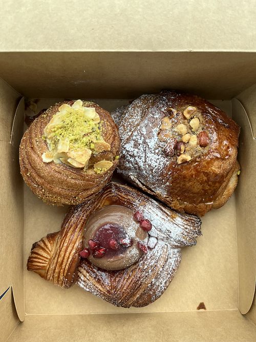Top left - double baked pistachio and blueberry cruffin. Top right - hazelnut and chocolate pain. Bottom - speculoos danish  at Saint-Jean in Amsterdam