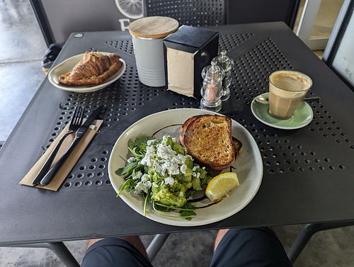 Avo toast and almond croissant at Flying West Coffee Roasters in Doonan