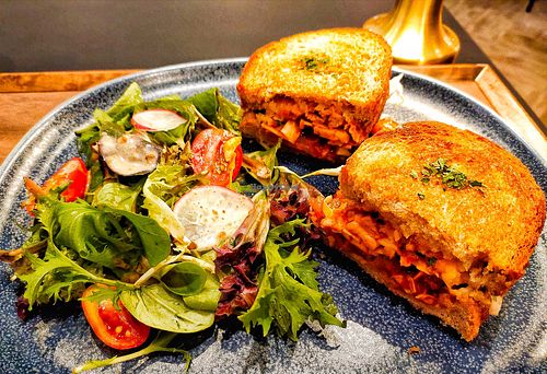 Vegan grilled cheese kimchi sandwich with salad, at Am I Addicted in Central Singapore