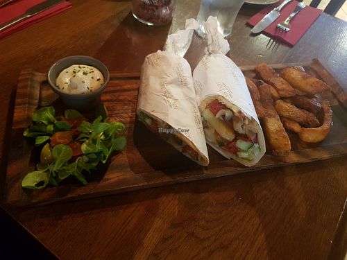 Vegan halloumi, red pepper and mushroom gyros with chips and salad at The Old Yard Tapas Bar in Darlington