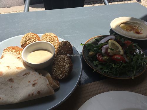 Part of vegetarian mezze (made vegan) : falafel, salad, hummus at Mezze in Lisbon