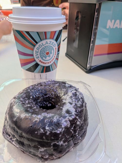 Purple vegan donut at Everglazed Donuts & Cold Brew in Lake Buena Vista