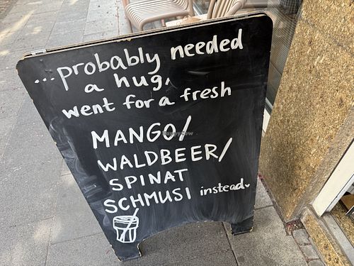 sign  at Café Rotkehlchen - Merowingerstraße in Cologne