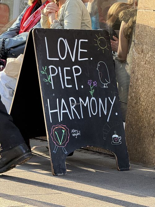 sign  at Café Rotkehlchen - Merowingerstraße in Cologne
