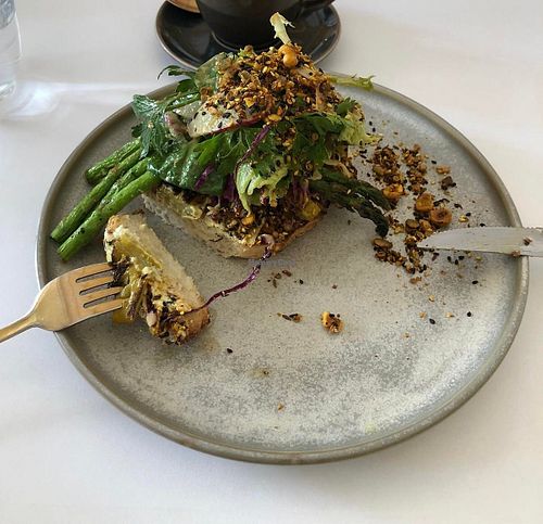 Grilled asparagus on toasted sourdough with sunflower seed hummus, braised fennel, hazelnut dukkah, shaved fennel salad, hazelnut and capper dressing at Calibrate Coffee in Roseville