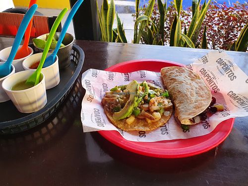 Taco rarito (left) and the C. Flor de Jamaica(right), which is a quesadilla at Coapenitos in Cancun