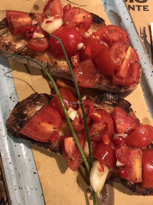 Bruschetta with fresh tomatoes, garlic and red hot chilli pepper  at Birrificio Torino in Turin