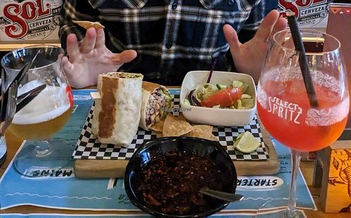 Burrito, salad and tequila sunrise at Pura Vida Vegan Tacos in Antwerpen