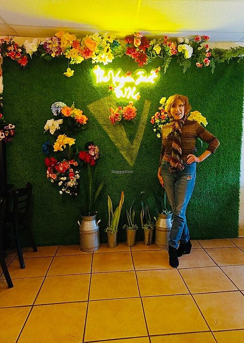 Me in front of the backdrop.  at The Vegan Joint in Woodland Hills