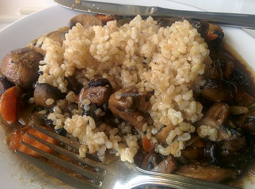 Sauteed mushrooms, vegetables over brown rice at Loving Hut - Sunset District in San Francisco