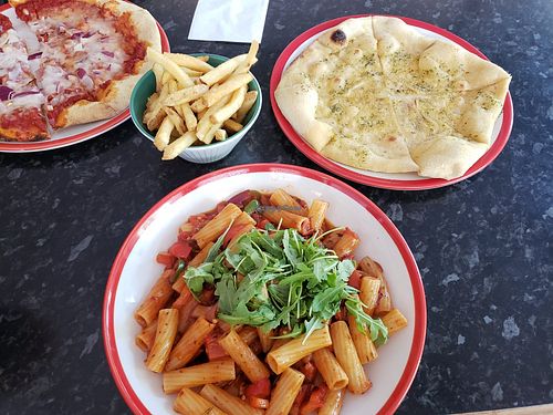 Vegan mozzarella and red onion pizza, fries, vegan garlic bread and red pepper, chilli and garlic pasta at Frankie & Benny's - Trafford Centre in Manchester