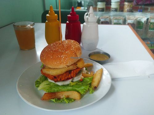 Hamburger with soya meat, fries and sauces at Devi Vegan Bistro in Lima