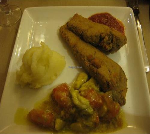 Dinner entree: Something that tasted like wheat gluten, breaded. With mashed potatoes (good) and an avocado/tomato 'salsa' was filling. at Amaltea in Barcelona