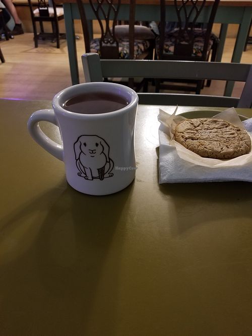 Tea in a cute mug next to the inedible cookie at Cup & Kettle Tea in Bloomington