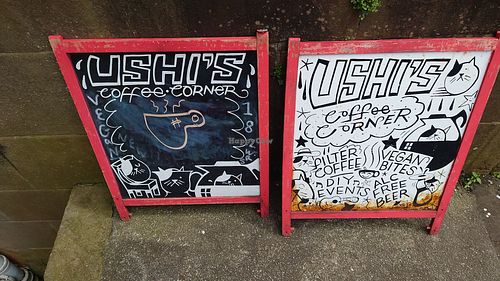 Signs outside at Ushi's Coffee Corner in Glasgow