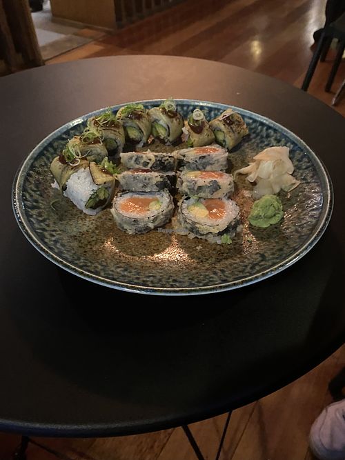 Aubergine inside out Maki with with sun dried tomatoes, cucumber and avocado. (Pictured alongside a melting salmon roll)   at Wawa in South East London