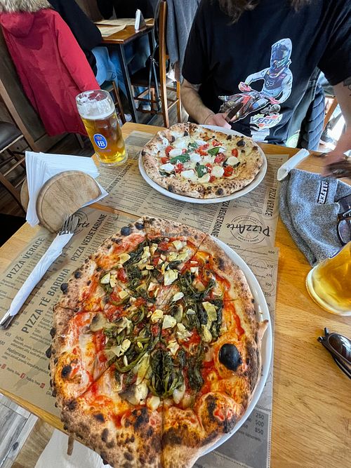Vegan pizza (front) and vegetarian caprese (back) at Pizzarte in Tirana