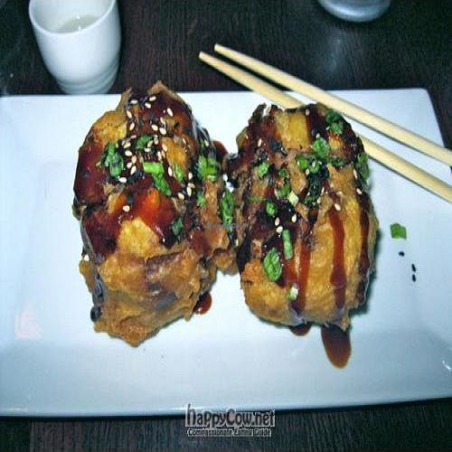 Garden Balls with Shiitake mushrooms, red pepper, cilantro and spicy rice in an inari pocket then tempura fried and drizzled with eel sauce. at Sticky Rice in Baltimore