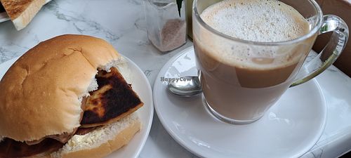 Potato scone roll and a latte at Cafe Mira in Glasgow
