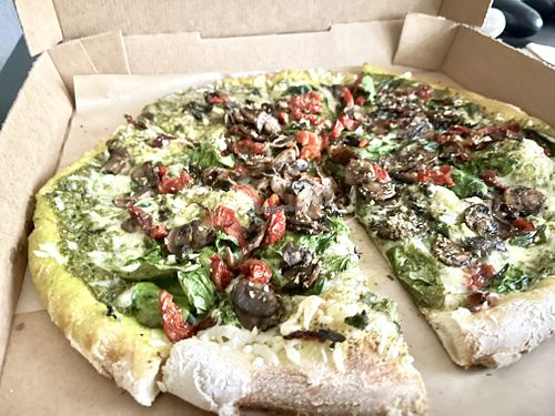 Vegan cheese, basil pesto sauce, garlic, oregano,  basil, sun dried tomatoes, mushrooms   at Your Pie in Houston