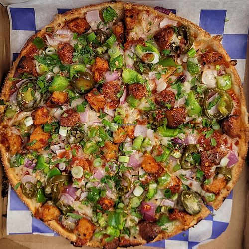 Vegan Manchurian Pizza Twist! 

This pizza has our signature vegan manchurian sauce, our signature vegan cauliflower bites, vegan cheese, crisp red onions, crisp bell peppers, spic at Pizza Twist in Fairfield