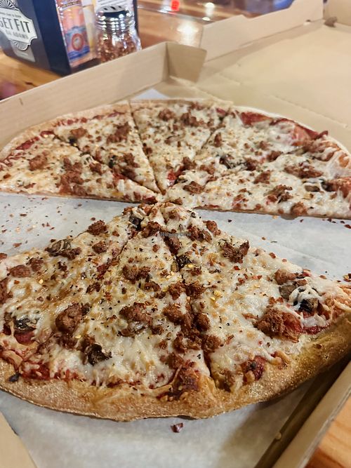Vegan cheese, plant based sausage, mushrooms, and thin whole grain crust. Delicious!   at Pizza Port - Ocean Beach in San Diego