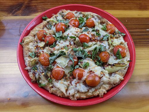 Custom Pizza: 10", Whole Grain Beer Crust, Black Bean Sauce, Vegan Cheese, Artichoke Hearts, Basil, Cherry Tomatoes, Red Pepper Flakes #Veganuary at Pizza Port - Solana Beach in Solana Beach