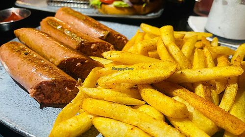 Ray's sausages and fries at Alpaca Bar in Tel Aviv