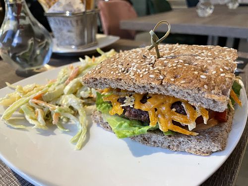 Signature Burger with coleslaw  at Elysian Plant Based Kitchen Bar in Limassol