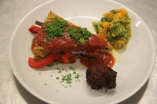 Polenta w olives stuffed with vegetables in a tomato sauce, pumpking and brocoli salad. at Govinda's Restaurant in Septon