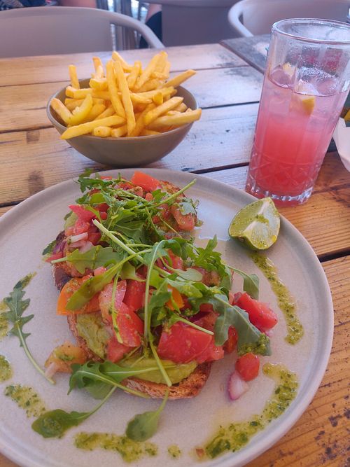 Avocado toast, fries & pink lemonade. Nice! at Bar Habana in Praia Da Luz