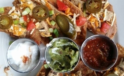 nachos with vegan cheese and soy chicken at Anvil Pub in Dallas
