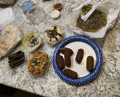 Dolmas, batata hara, baba ganoush, hummus, falafel, za’atar manaqish  at Jafra Mediterranean Restaurant in St Charles