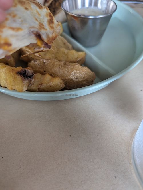 Greasy, tasteless vegetarian food. Dirty tables and--even though the restaurant was empty--the waitress would not let us sit at a table but made my toddler sit at a dirty bar.  at Yellow Bark in La Fortuna